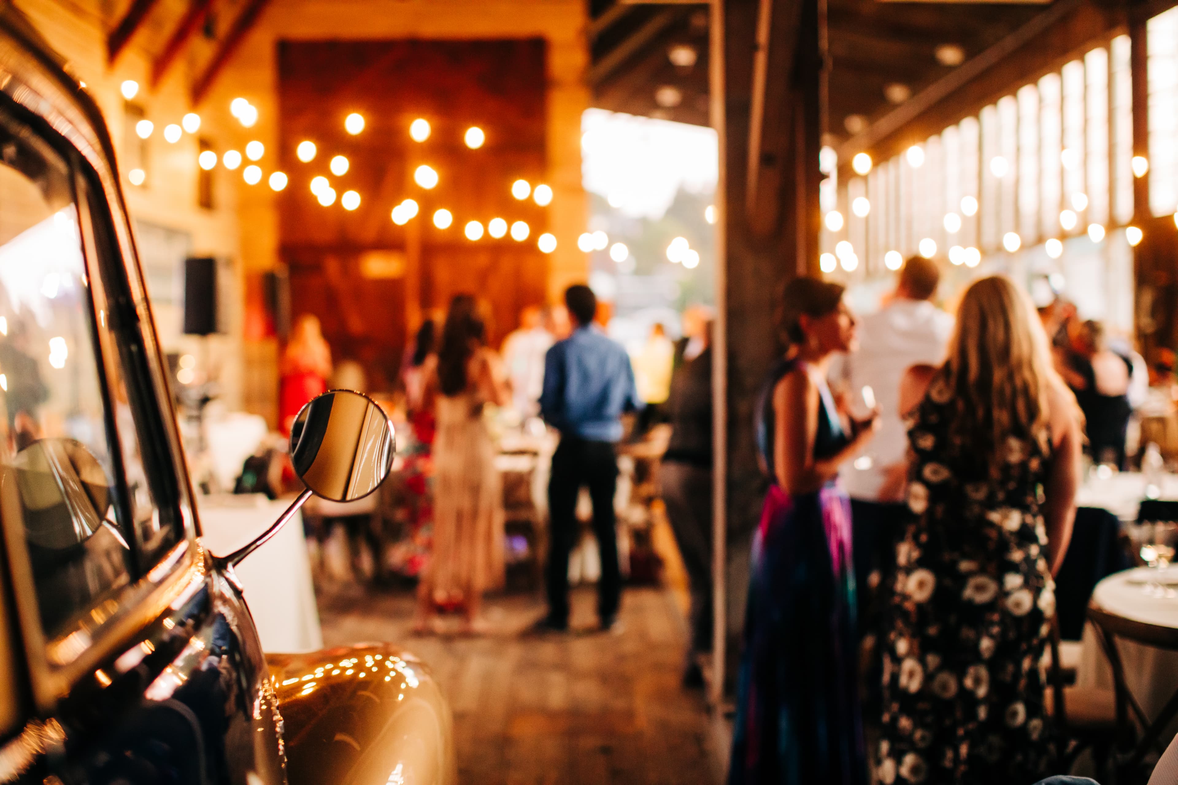 Wedding guests dancing in the barn during the reception
